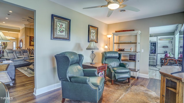living area featuring baseboards, wood finished floors, recessed lighting, and a ceiling fan