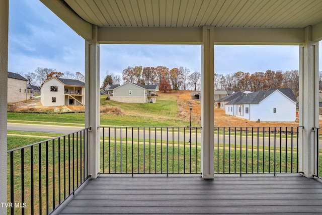 wooden deck with a yard