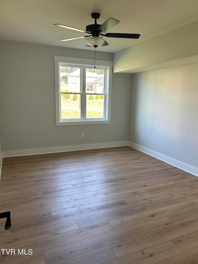 unfurnished room featuring wood-type flooring and ceiling fan