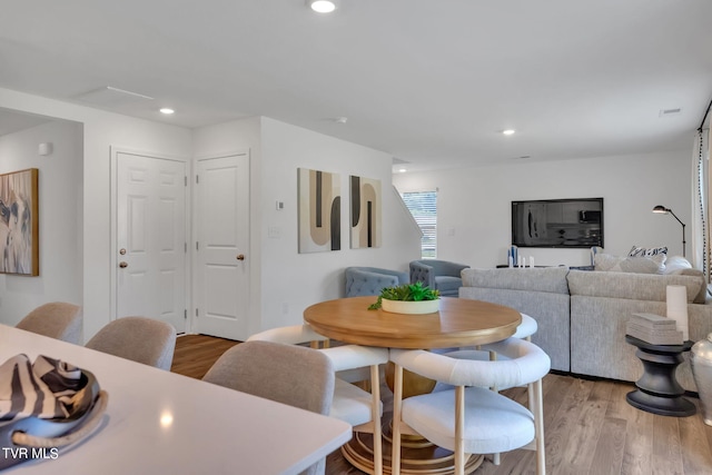 dining space featuring light wood-type flooring