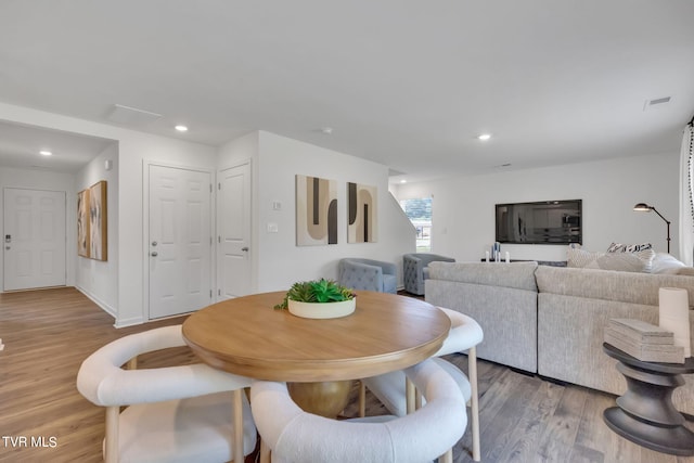 dining space featuring light hardwood / wood-style flooring