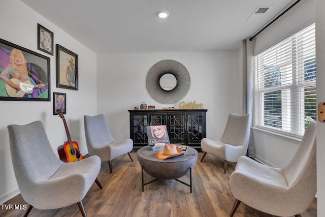 living area with hardwood / wood-style flooring