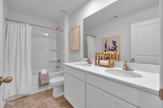 full bathroom featuring vanity, toilet, and shower / bath combo