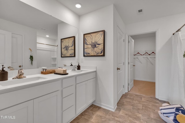 bathroom with vanity and curtained shower