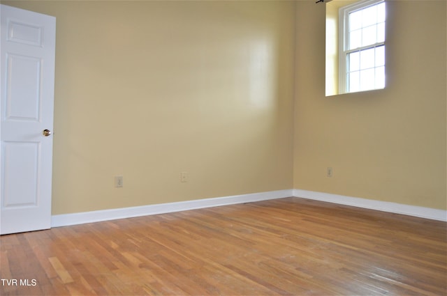 spare room with light hardwood / wood-style floors