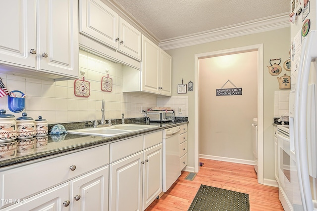 110 Eagle View Private Dr Unit 110, Blountville, TN 37617 - kitchen featuring white dishwasher, dark countertops, light wood-style floors, white cabinets, and ornamental molding