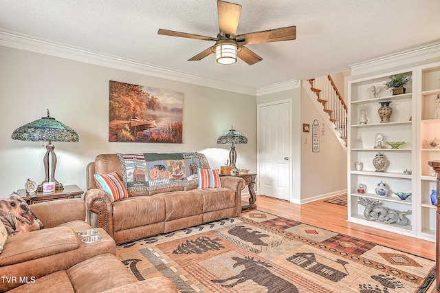 110 Eagle View Private Dr Unit 110, Blountville, TN 37617 - living room featuring a ceiling fan, crown molding, light wood-style floors, stairway, and a textured ceiling