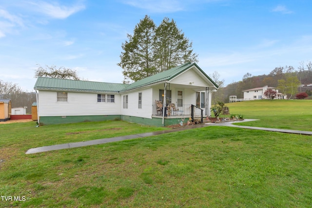 view of front of house with a front lawn and a porch