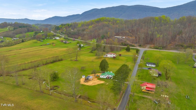 drone / aerial view featuring a mountain view and a rural view