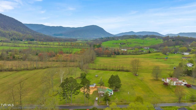 exterior space with a rural view and a mountain view