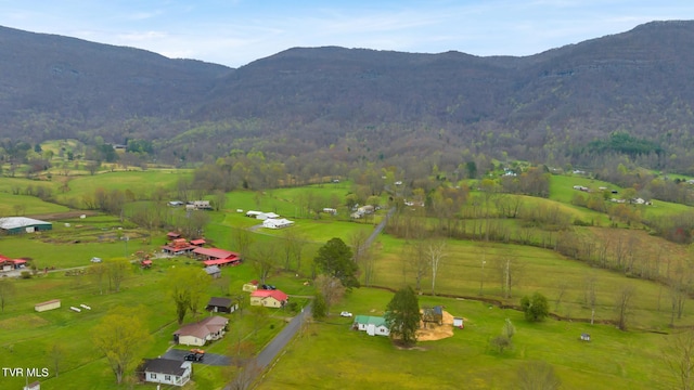 drone / aerial view featuring a rural view and a mountain view