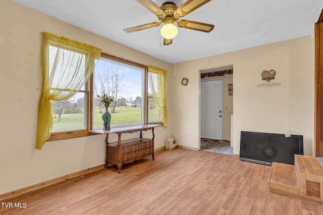 interior space featuring light hardwood / wood-style floors and ceiling fan