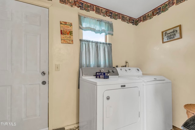 washroom with independent washer and dryer