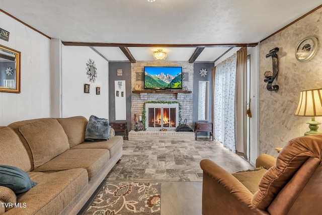 living room with brick wall, beamed ceiling, a textured ceiling, and a fireplace