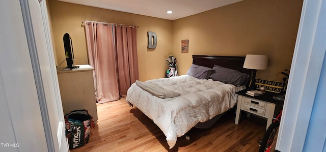 bedroom with light wood-type flooring