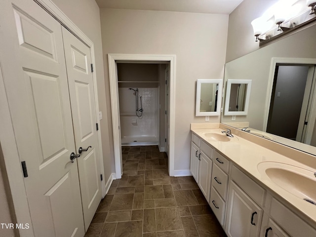 bathroom featuring double vanity and tile floors