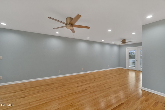 spare room featuring light hardwood / wood-style flooring, french doors, and ceiling fan