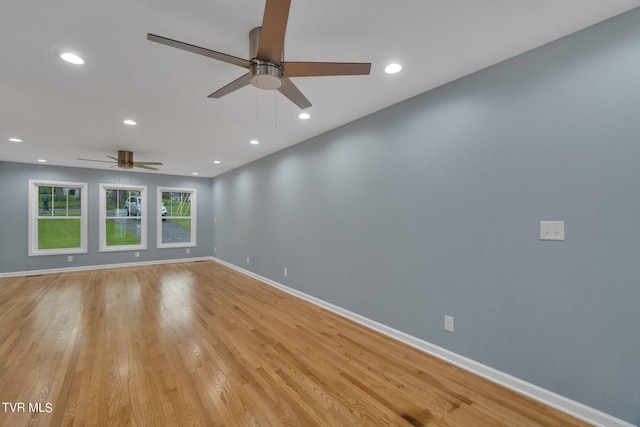 unfurnished room featuring ceiling fan and light wood-type flooring