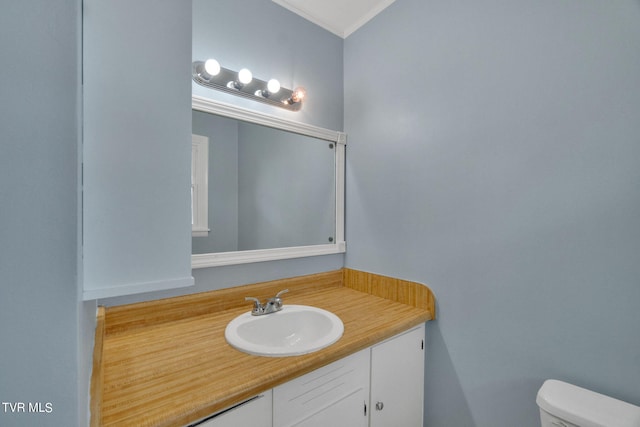 bathroom with toilet and vanity