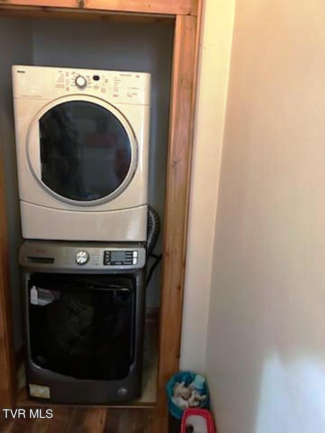 laundry area with stacked washer / drying machine