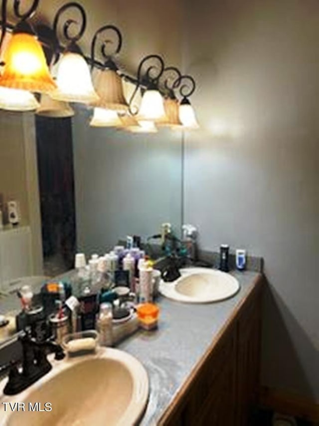 bathroom with vanity with extensive cabinet space