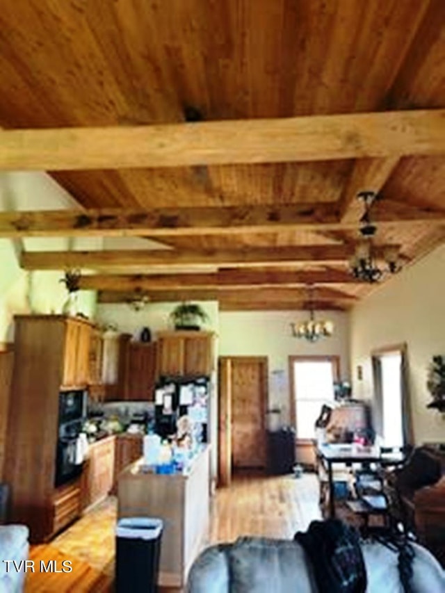 kitchen featuring beam ceiling, black appliances, wooden ceiling, light hardwood / wood-style flooring, and an inviting chandelier