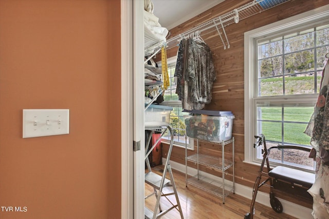 spacious closet with light hardwood / wood-style floors