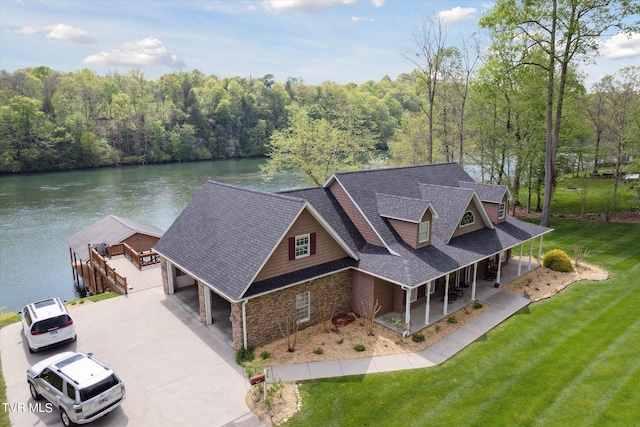 birds eye view of property featuring a water view