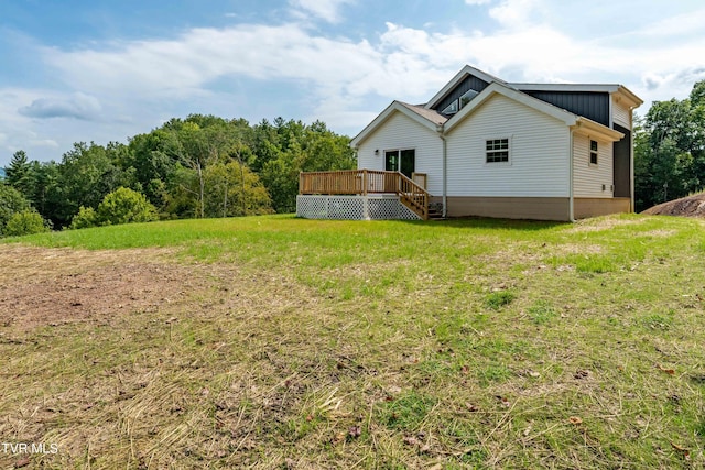 view of yard with a wooden deck