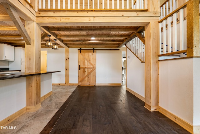 interior space featuring a barn door and hardwood / wood-style flooring