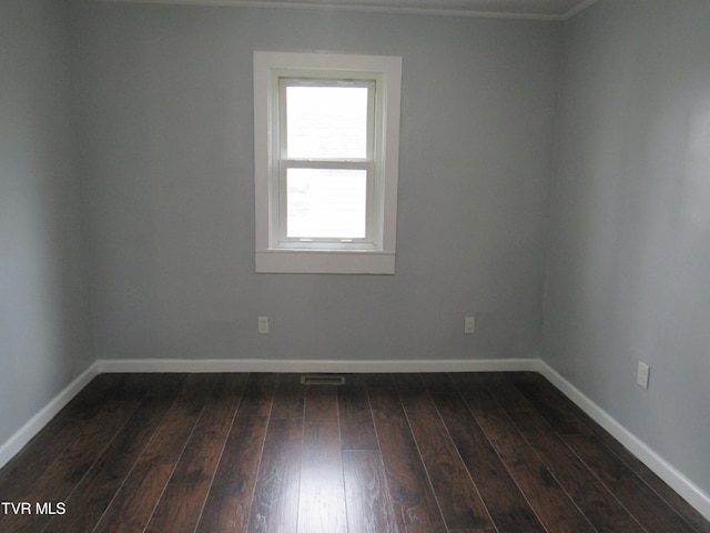 spare room with hardwood / wood-style flooring