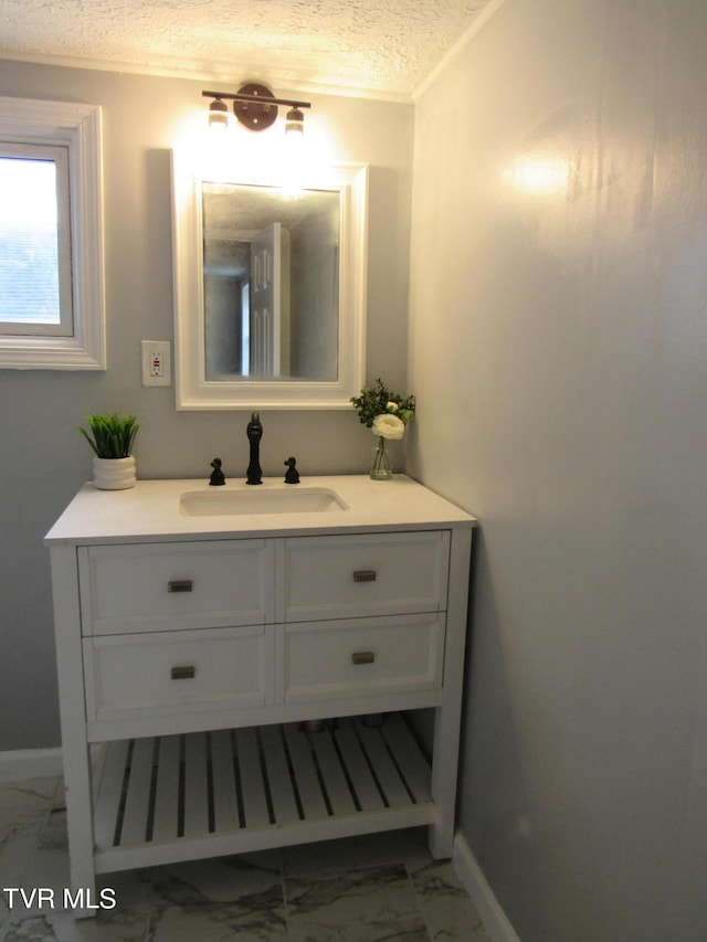 bathroom featuring tile floors, vanity, and a textured ceiling