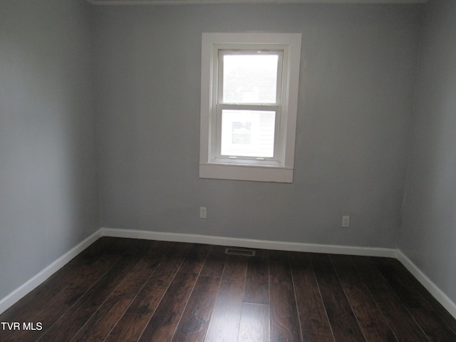 spare room featuring hardwood / wood-style flooring