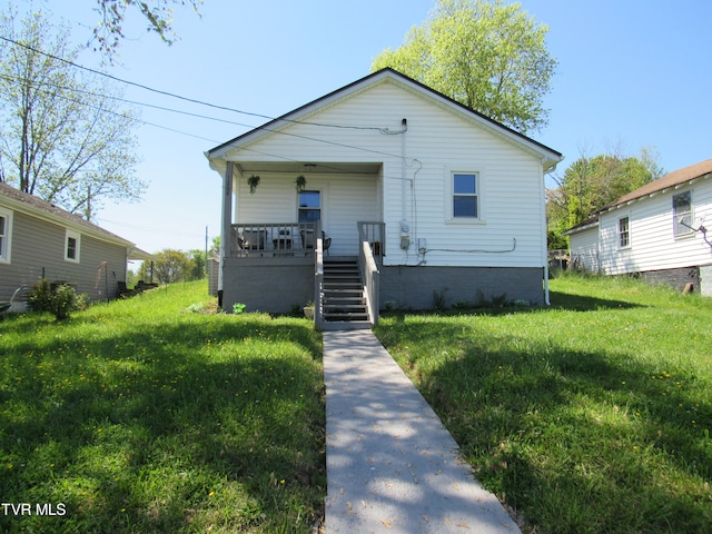 bungalow-style house with a front lawn