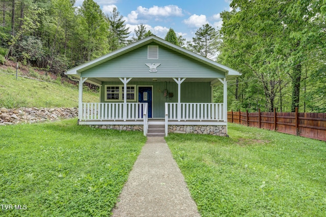 bungalow-style home featuring a front yard and a porch