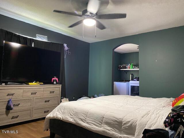 bedroom featuring hardwood / wood-style floors and ceiling fan