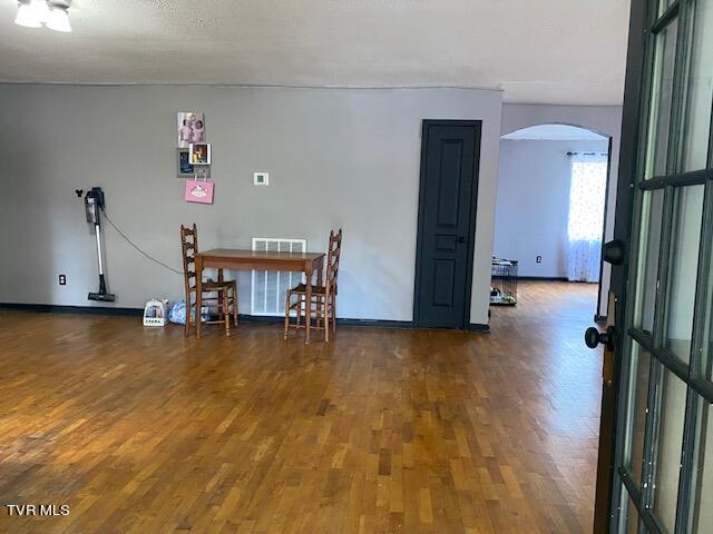 unfurnished dining area with dark hardwood / wood-style floors