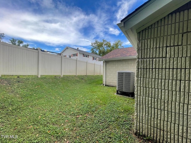 view of yard featuring central AC unit