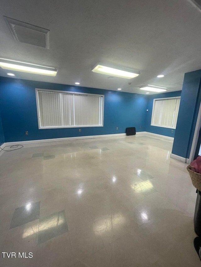 basement featuring tile flooring