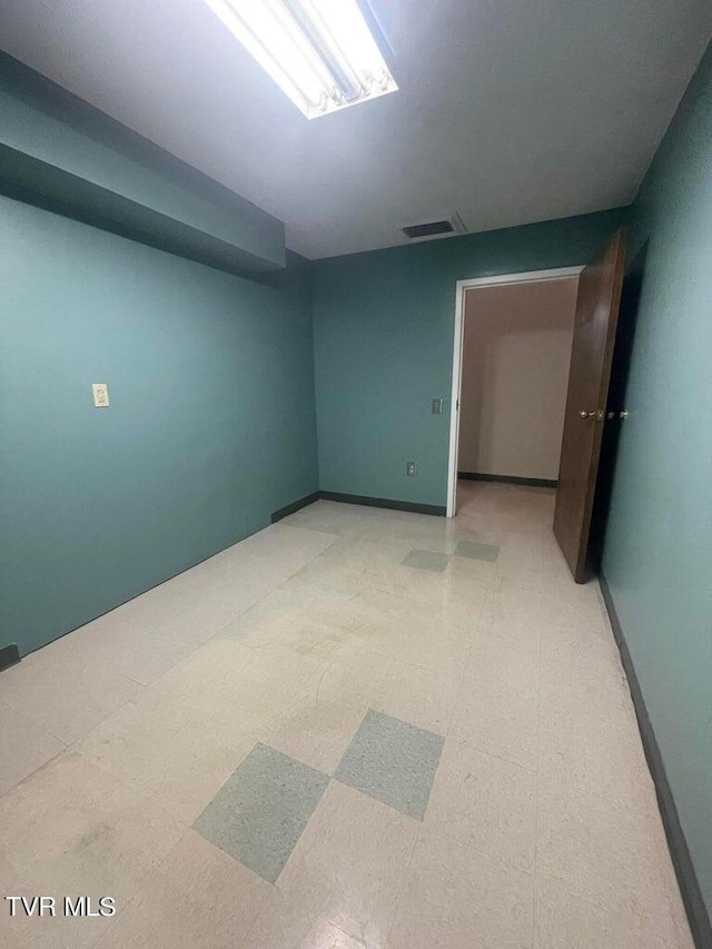 basement featuring tile flooring