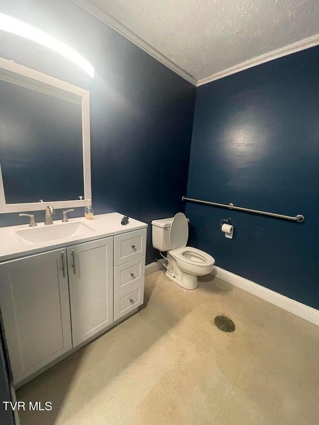 bathroom with vanity, ornamental molding, tile flooring, toilet, and a textured ceiling