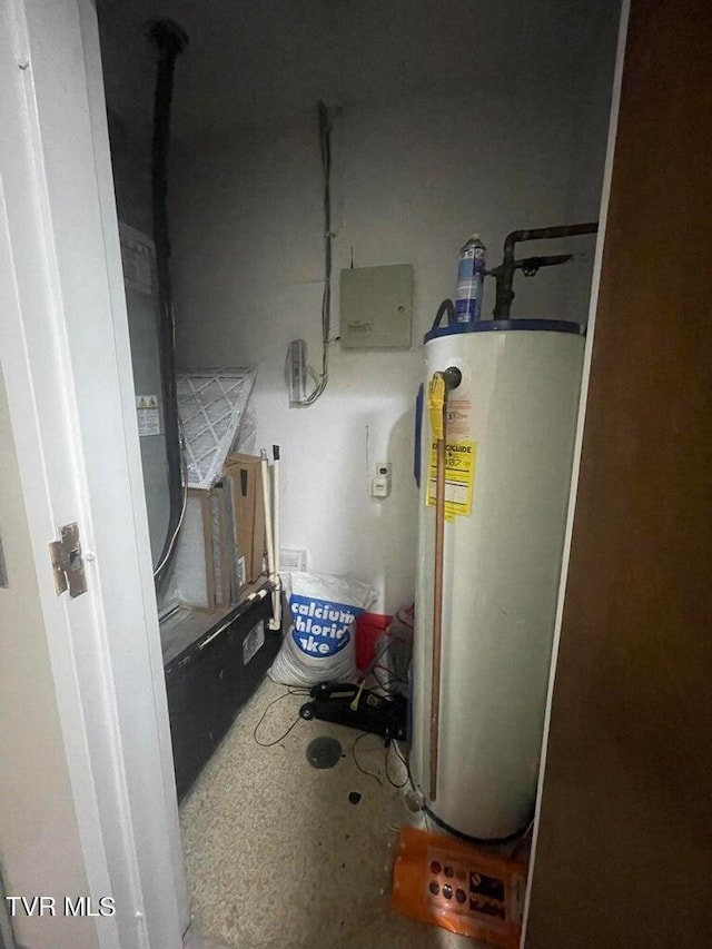 utility room featuring water heater