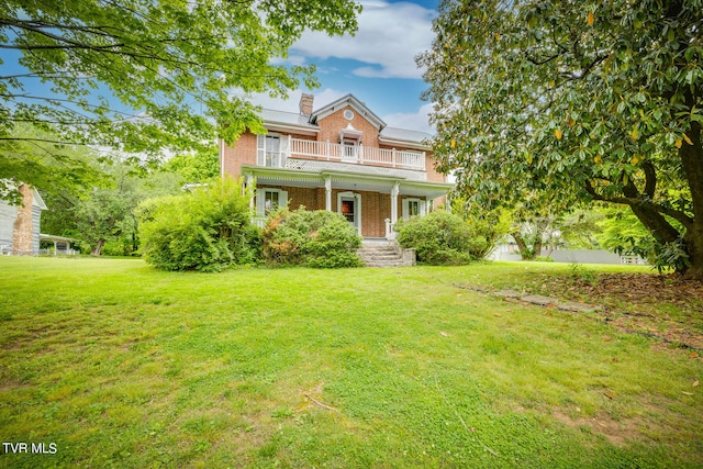 view of front of home with a front lawn and covered porch