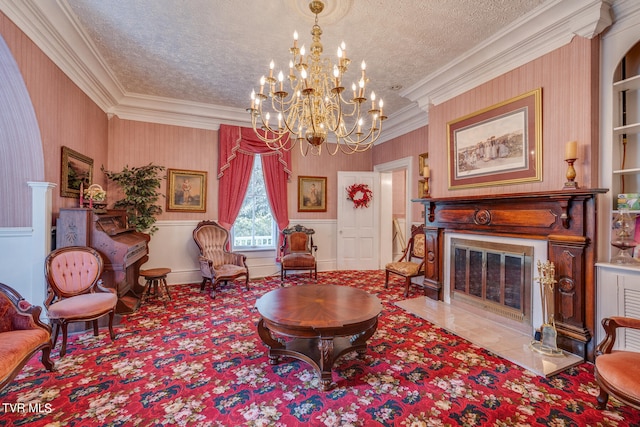 living room featuring a textured ceiling, an inviting chandelier, and ornamental molding