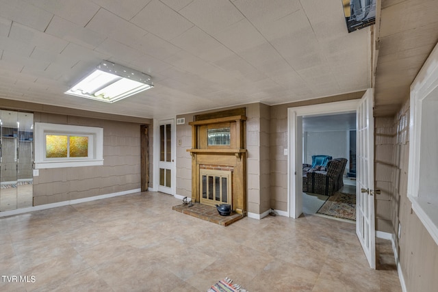 unfurnished living room with tile flooring