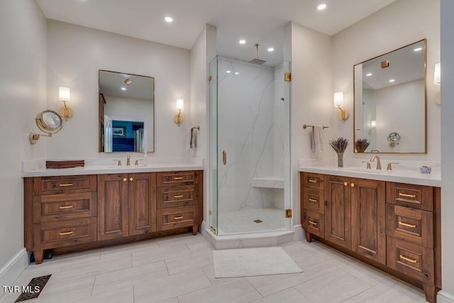 bathroom with tile patterned flooring, walk in shower, and double vanity