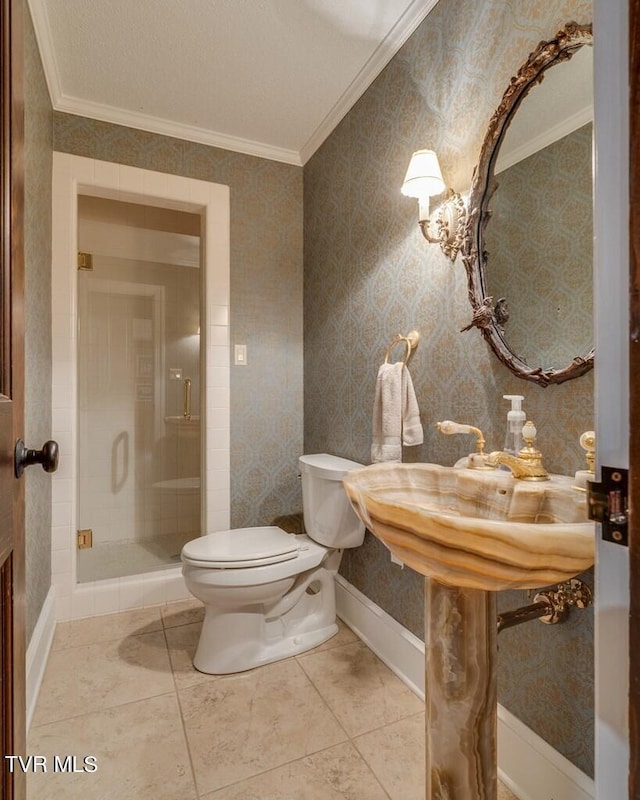 bathroom featuring tile patterned floors, crown molding, an enclosed shower, toilet, and a textured ceiling