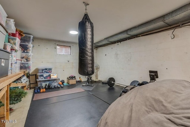 exercise room featuring concrete floors