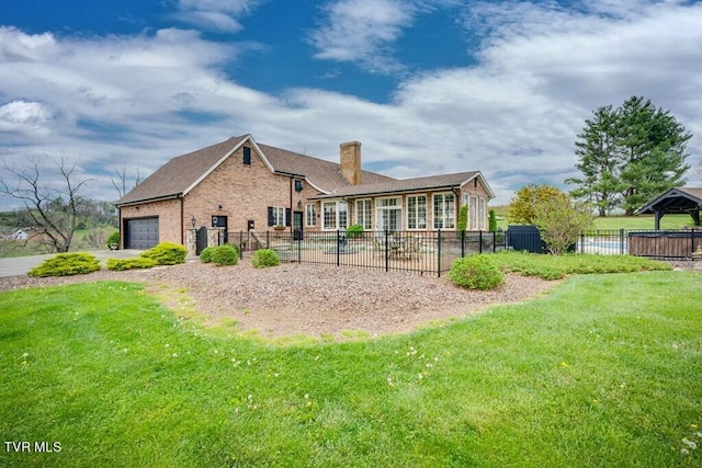 rear view of property featuring a yard