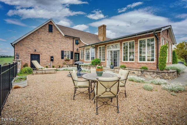 back of property featuring a patio area